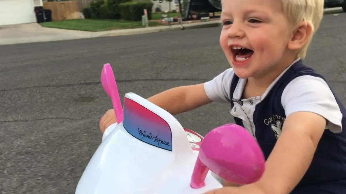 Happy kid on scooter